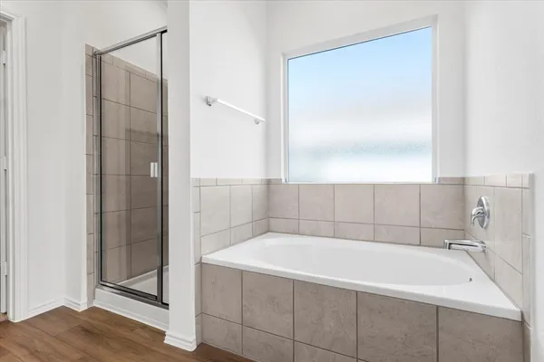 an empty room with a window and doors