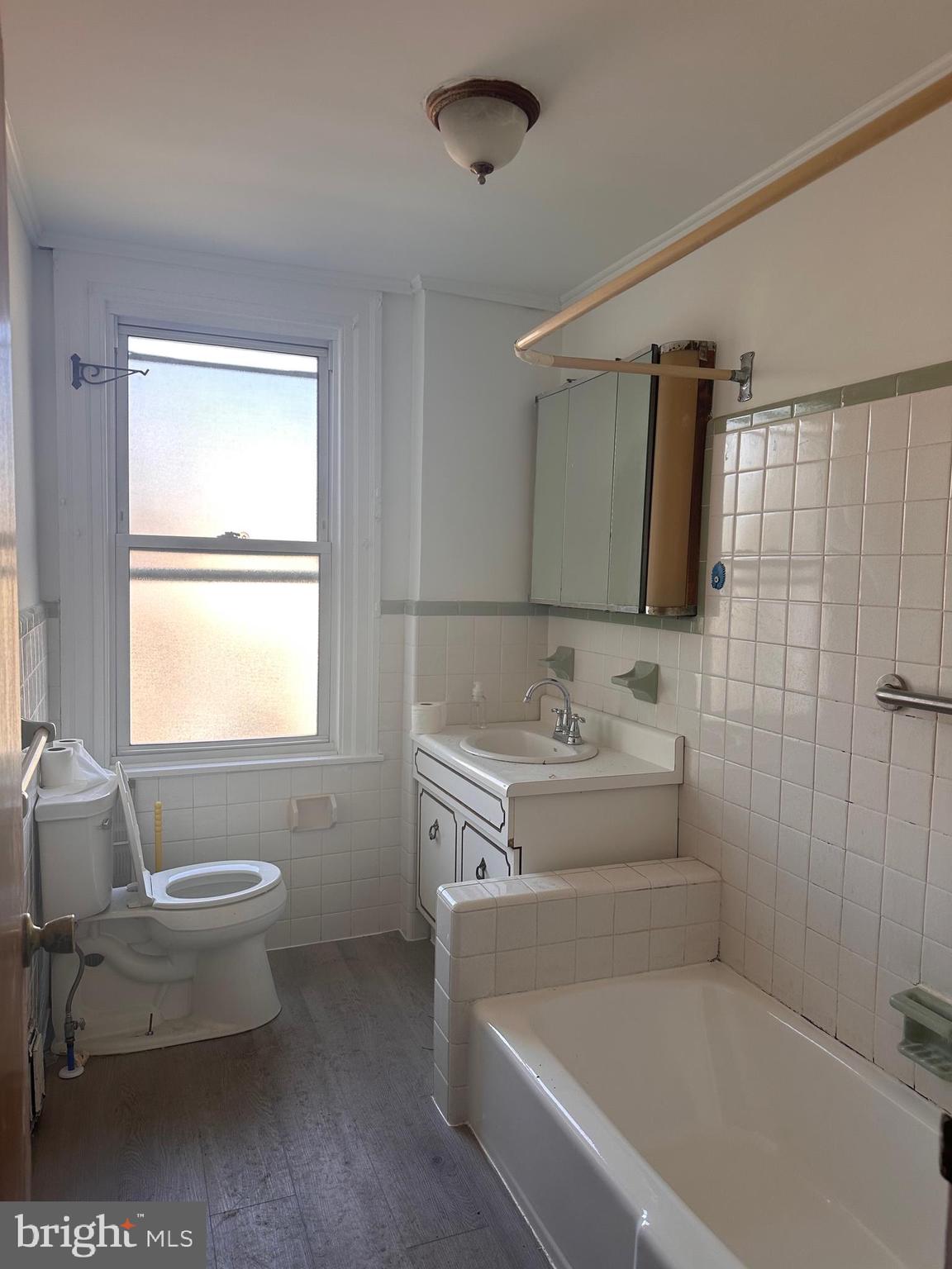 402 Walter Street Philadelphia, PA 19111 - Photo 9 of 15 a bathroom with a tub sink and mirror