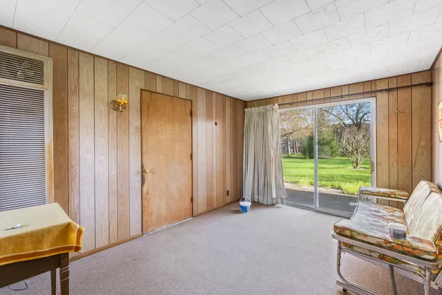a view of a room with furniture and a window