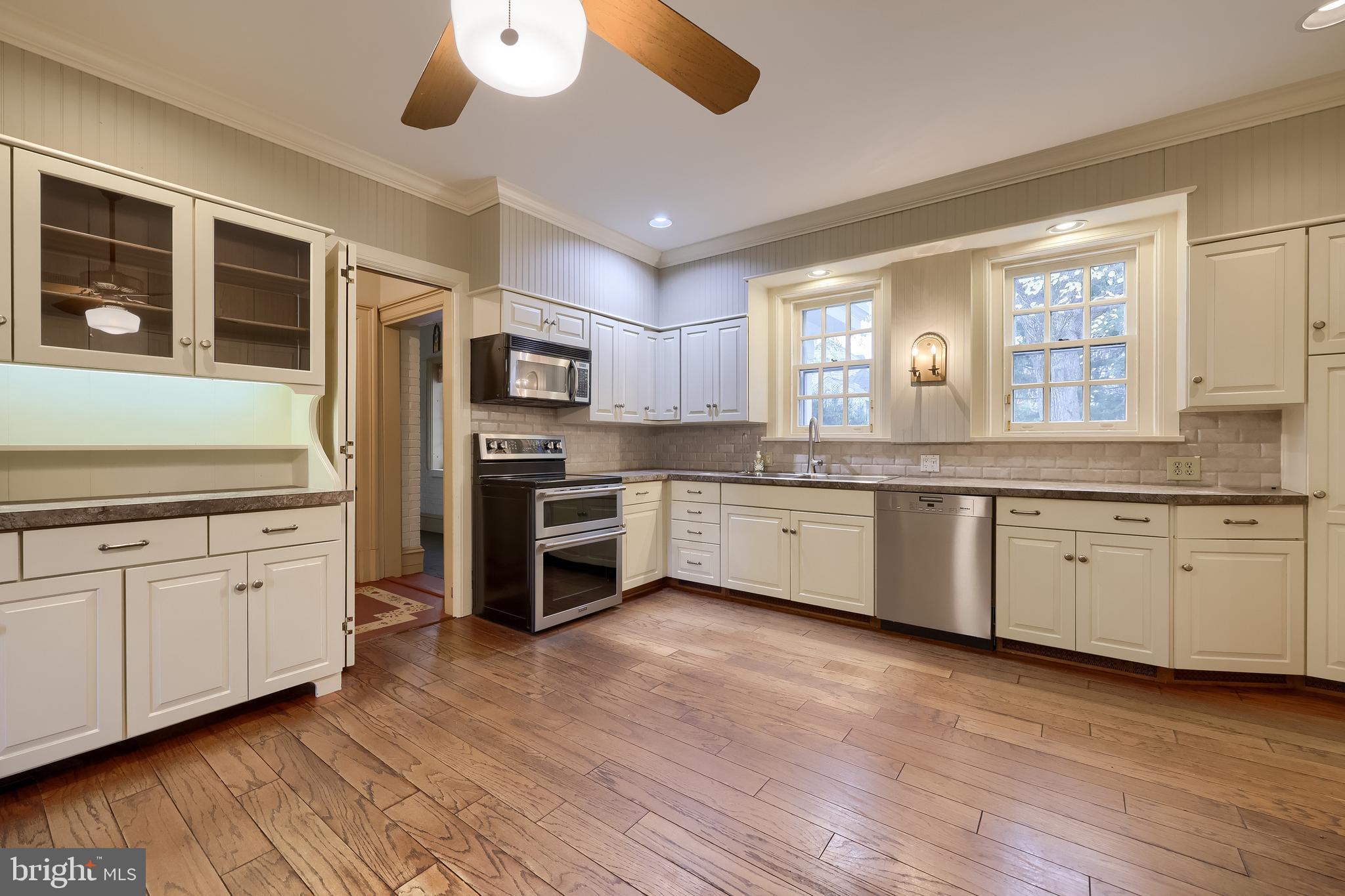 226 East Caracas Avenue Hershey, PA 17033 - Photo 19 of 67 a kitchen with granite countertop a sink cabinets and stainless steel appliances