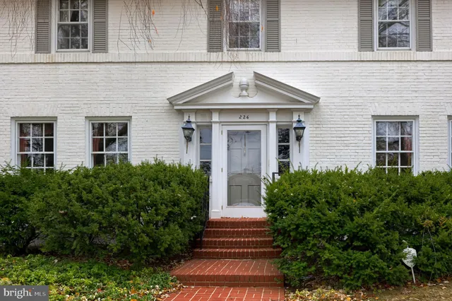 a front view of house and yard with green space