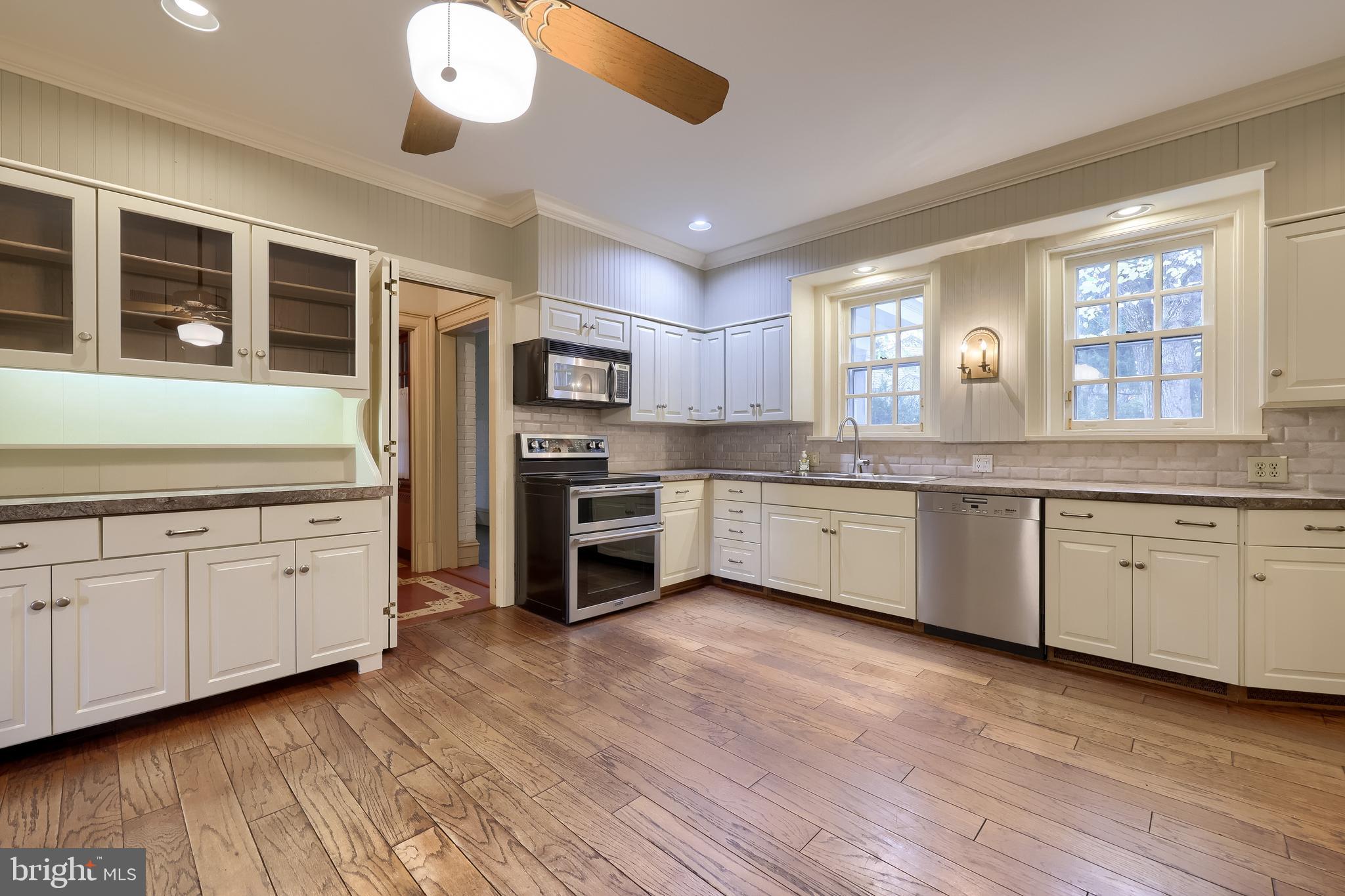 226 East Caracas Avenue Hershey, PA 17033 - Photo 21 of 67 a kitchen with granite countertop white cabinets and white appliances