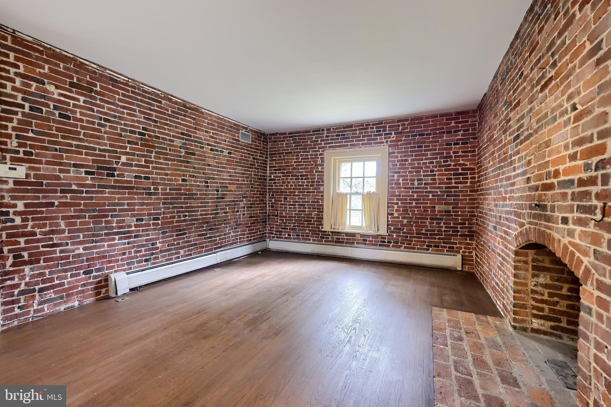 226 East Caracas Avenue Hershey, PA 17033 - Photo 28 of 67 a view of a livingroom with wooden floor and windows