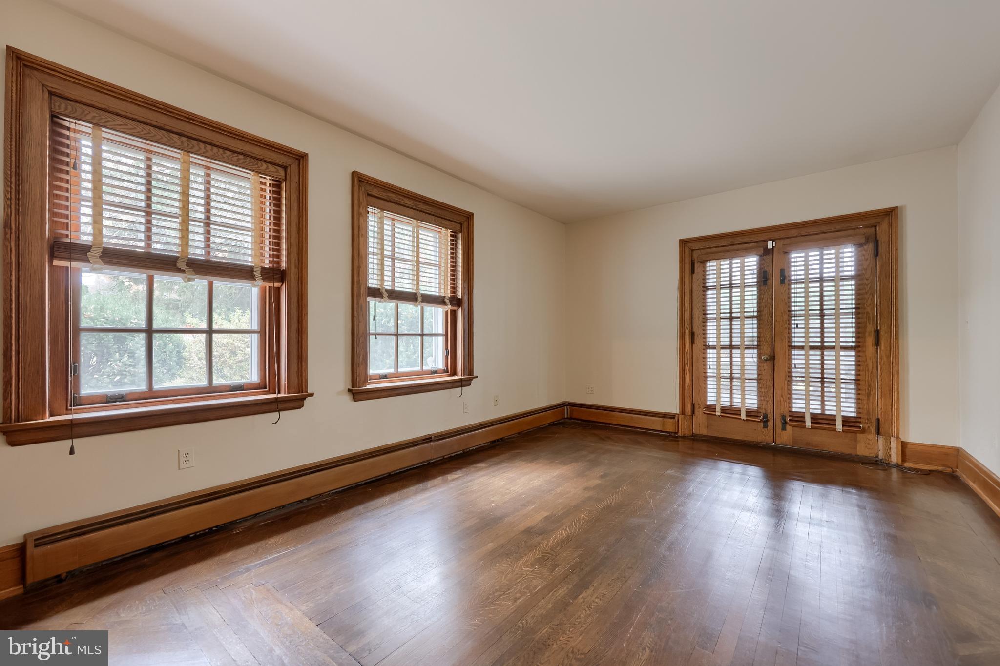 226 East Caracas Avenue Hershey, PA 17033 - Photo 31 of 67 a view of an empty room with wooden floor and a window