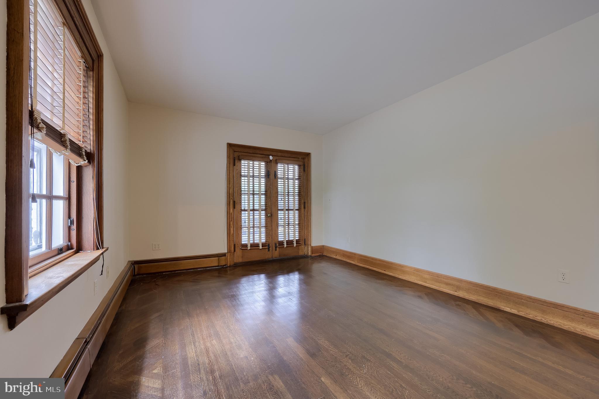 226 East Caracas Avenue Hershey, PA 17033 - Photo 32 of 67 a view of an empty room with wooden floor and a window