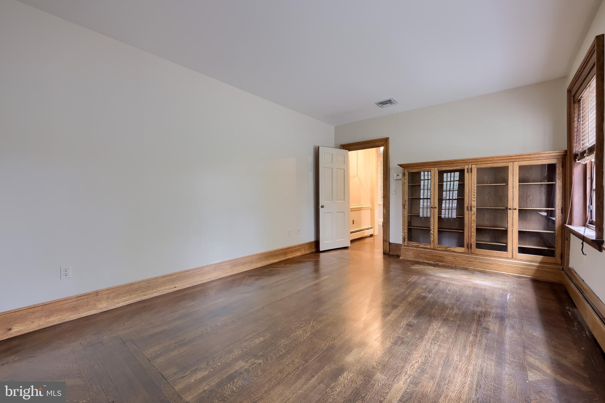 226 East Caracas Avenue Hershey, PA 17033 - Photo 33 of 67 a view of an empty room with wooden floor and garden