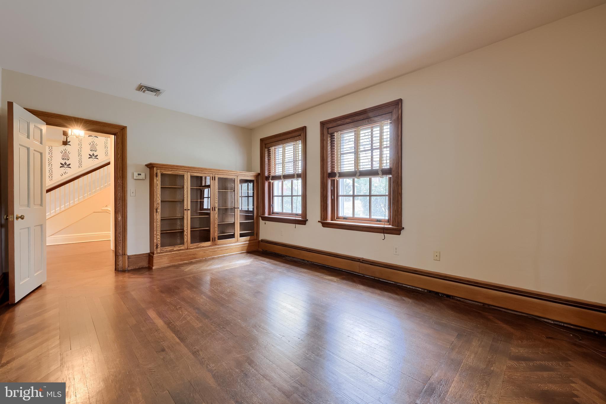 226 East Caracas Avenue Hershey, PA 17033 - Photo 34 of 67 a view of an empty room with wooden floor and a window
