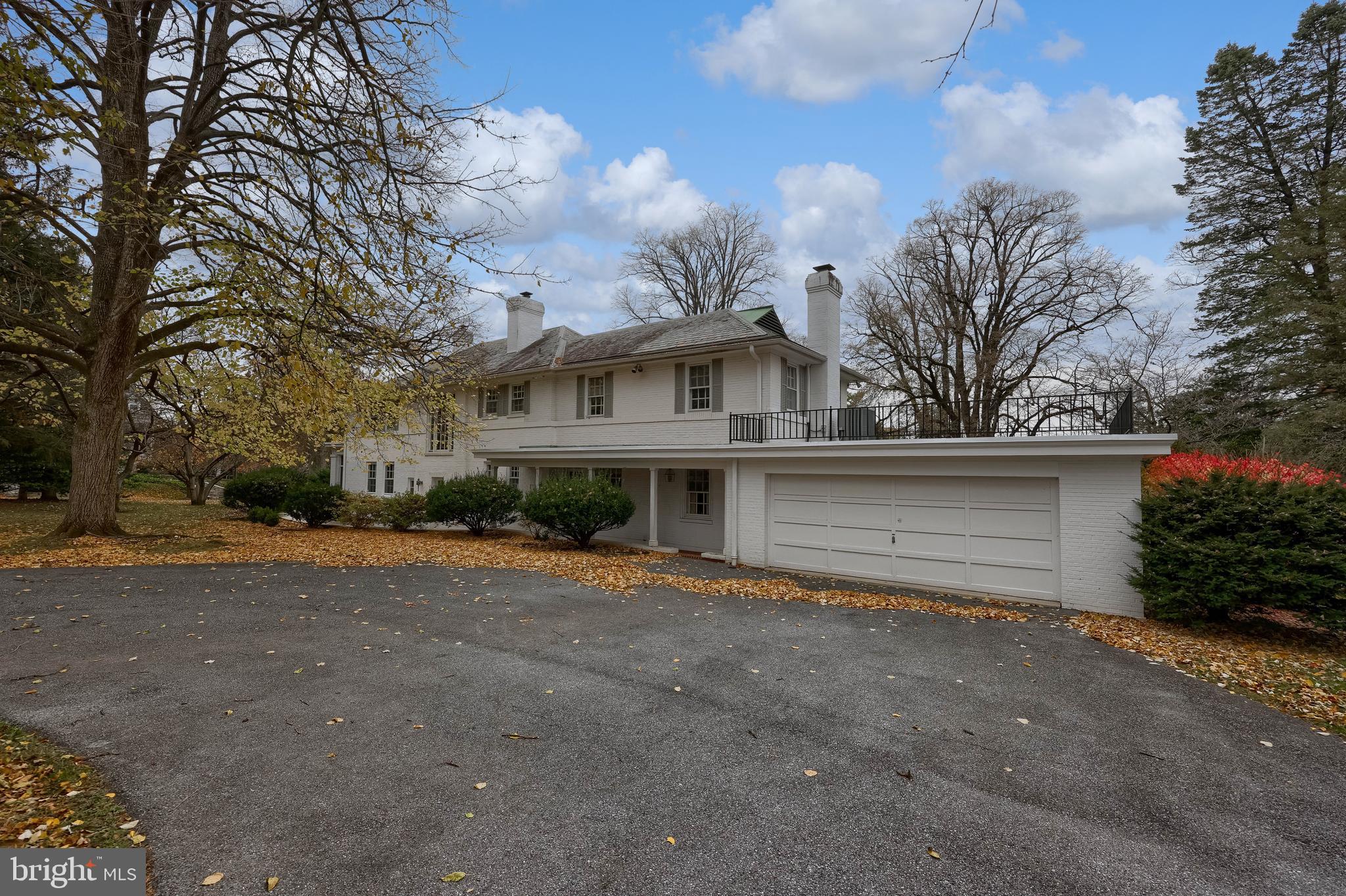 226 East Caracas Avenue Hershey, PA 17033 - Photo 60 of 67 a front view of a house with a yard and garage