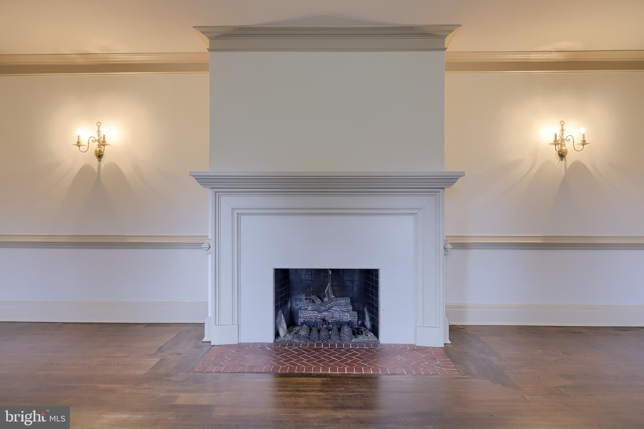 226 East Caracas Avenue Hershey, PA 17033 - Photo 10 of 67 a living room with a fireplace and a chandelier