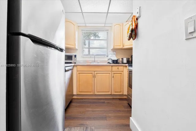 a view of a kitchen with electric appliances