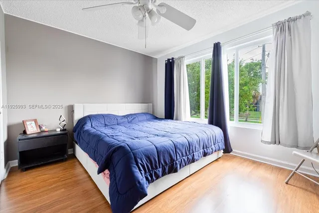 a view of a balcony with potted plants