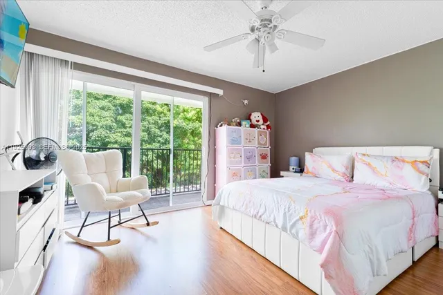 a bathroom with a sink toilet vanity and shower