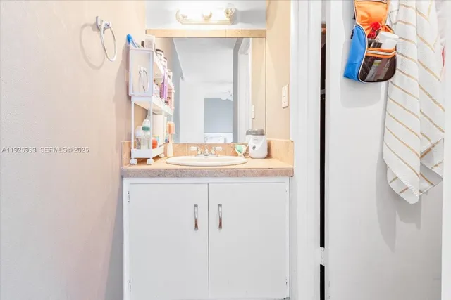 a view of bathroom with a toilet and a sink
