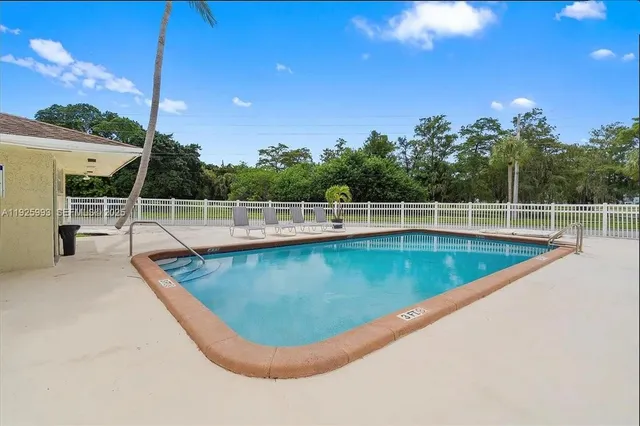 a view of a house with swimming pool