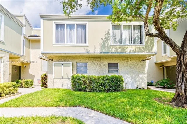 a view of a car parked in front of a house