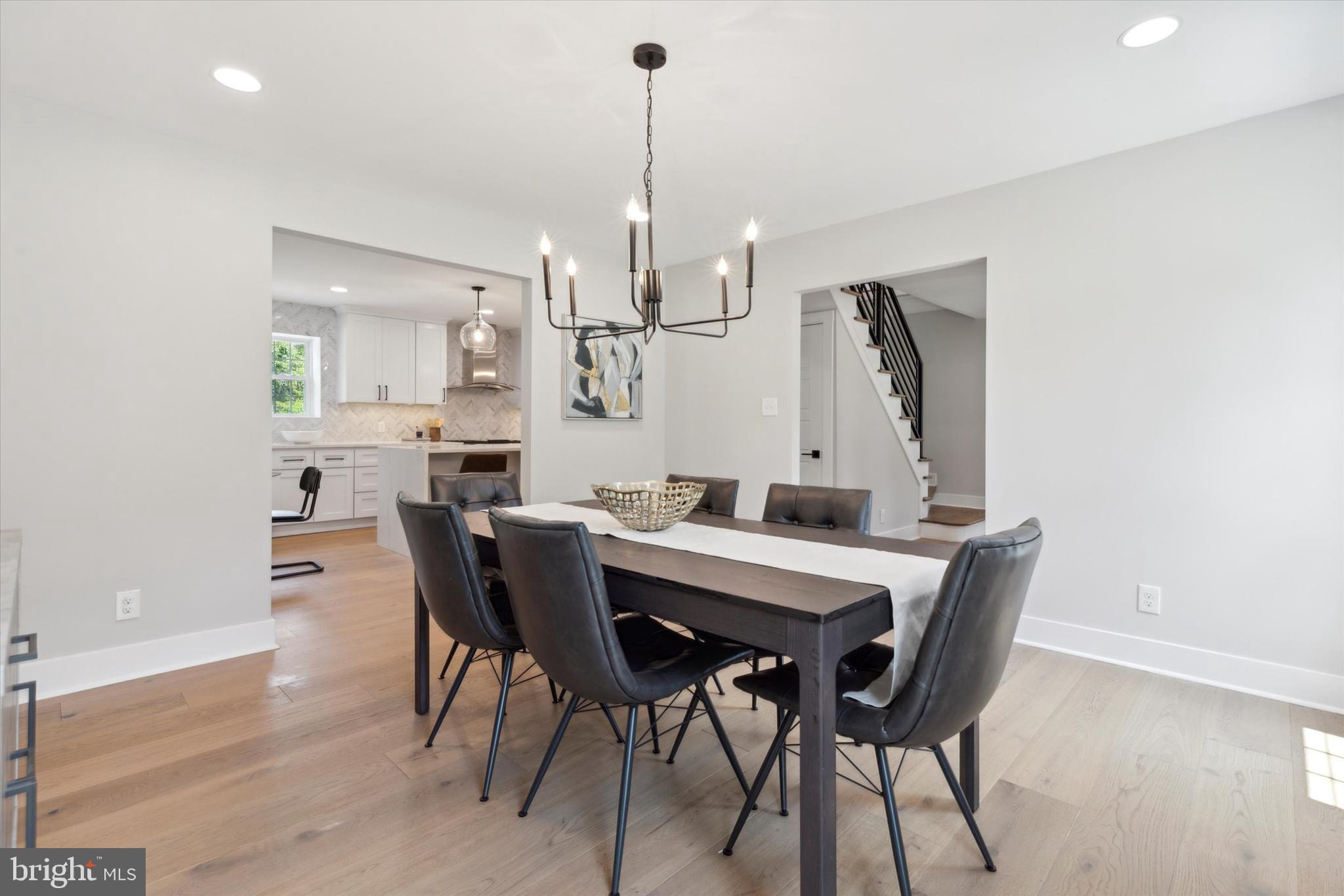 607 Golf Club Road Newtown Square, PA 19073 - Photo 14 of 86 a view of a dining room with furniture and wooden floor