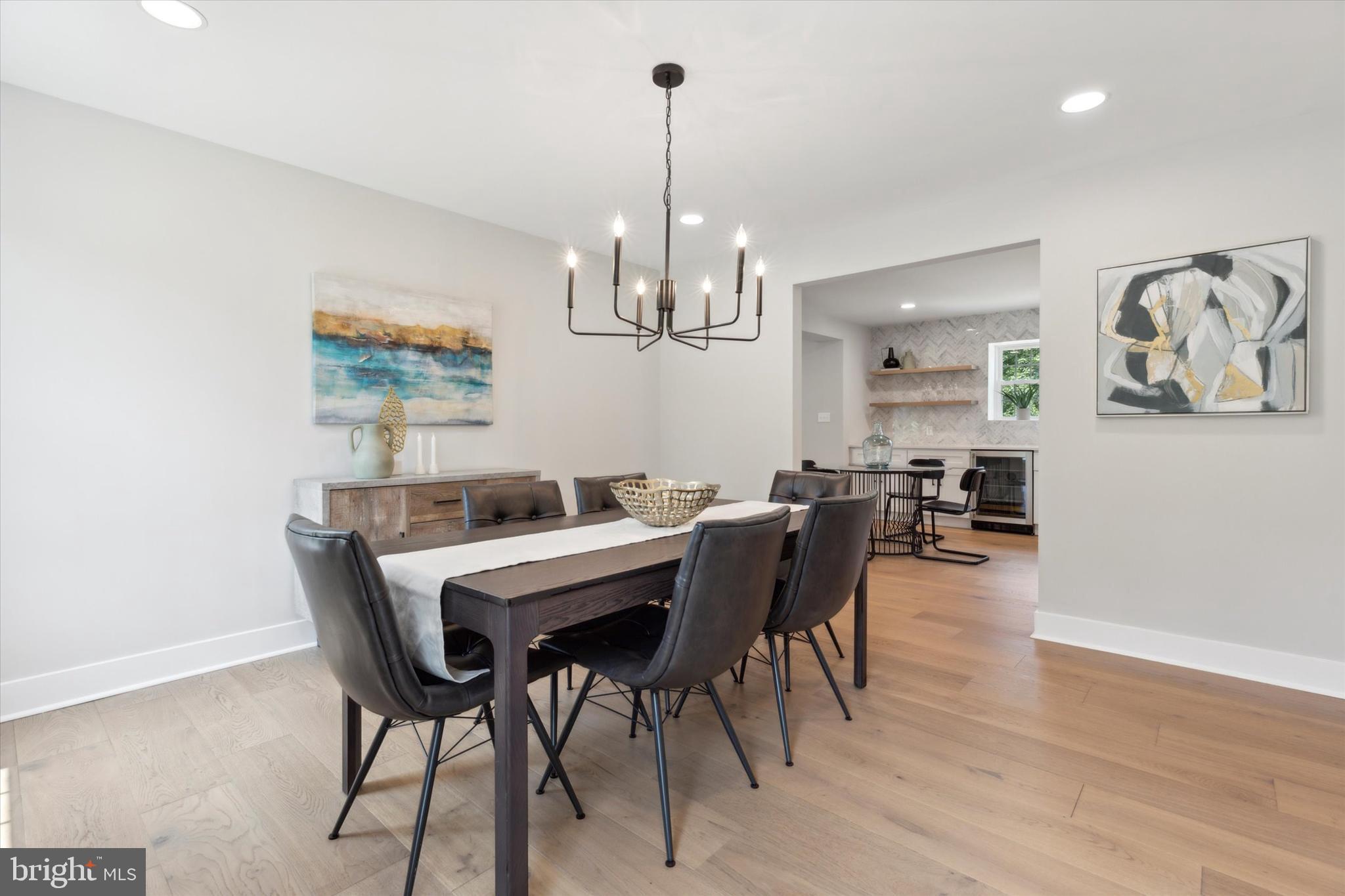 607 Golf Club Road Newtown Square, PA 19073 - Photo 15 of 86 a view of a dining room with furniture wooden floor and chandelier
