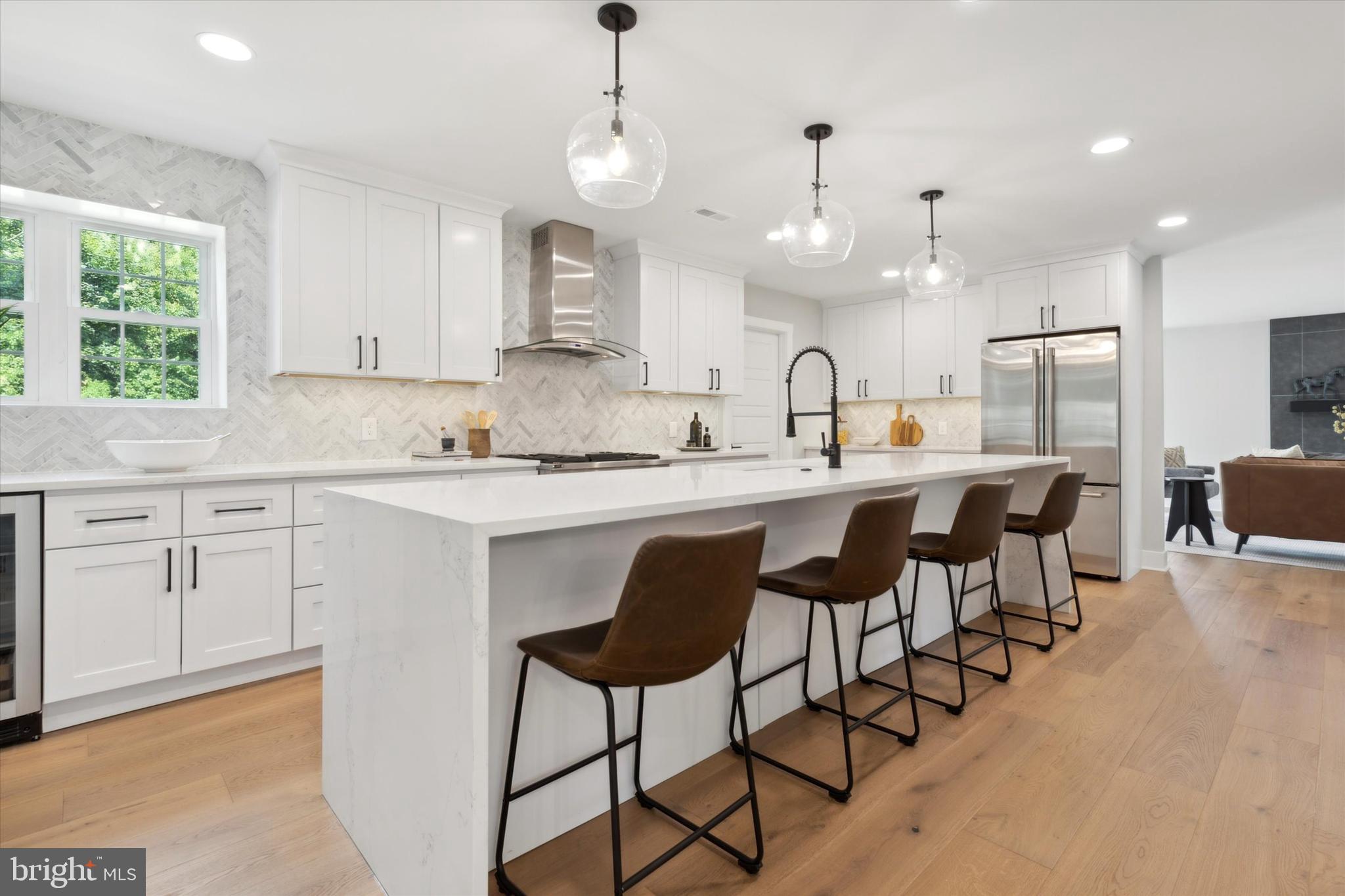 607 Golf Club Road Newtown Square, PA 19073 - Photo 17 of 86 a kitchen with stainless steel appliances kitchen island granite countertop a sink a stove a dining table and chairs