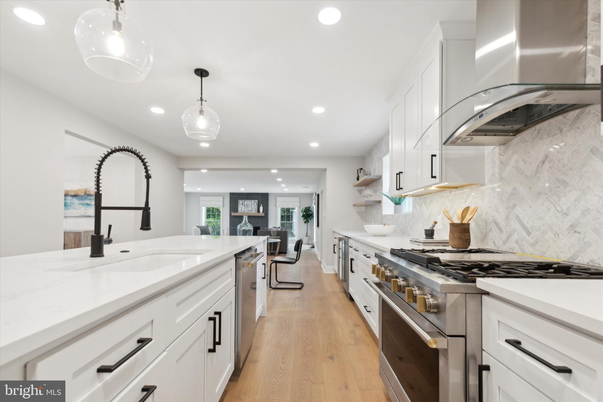 607 Golf Club Road Newtown Square, PA 19073 - Photo 18 of 86 a kitchen with stainless steel appliances a sink stove and cabinets