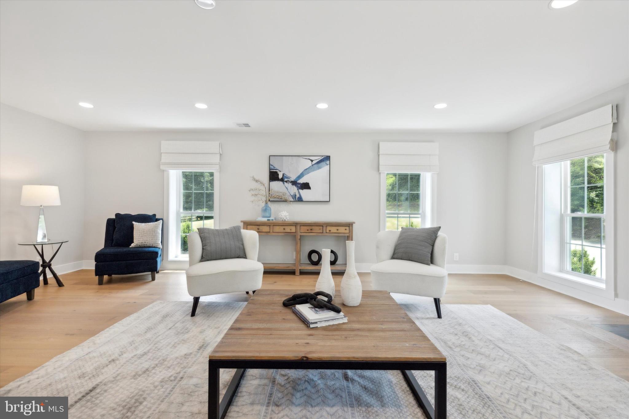 607 Golf Club Road Newtown Square, PA 19073 - Photo 33 of 86 a living room with furniture a flat screen tv and a large window