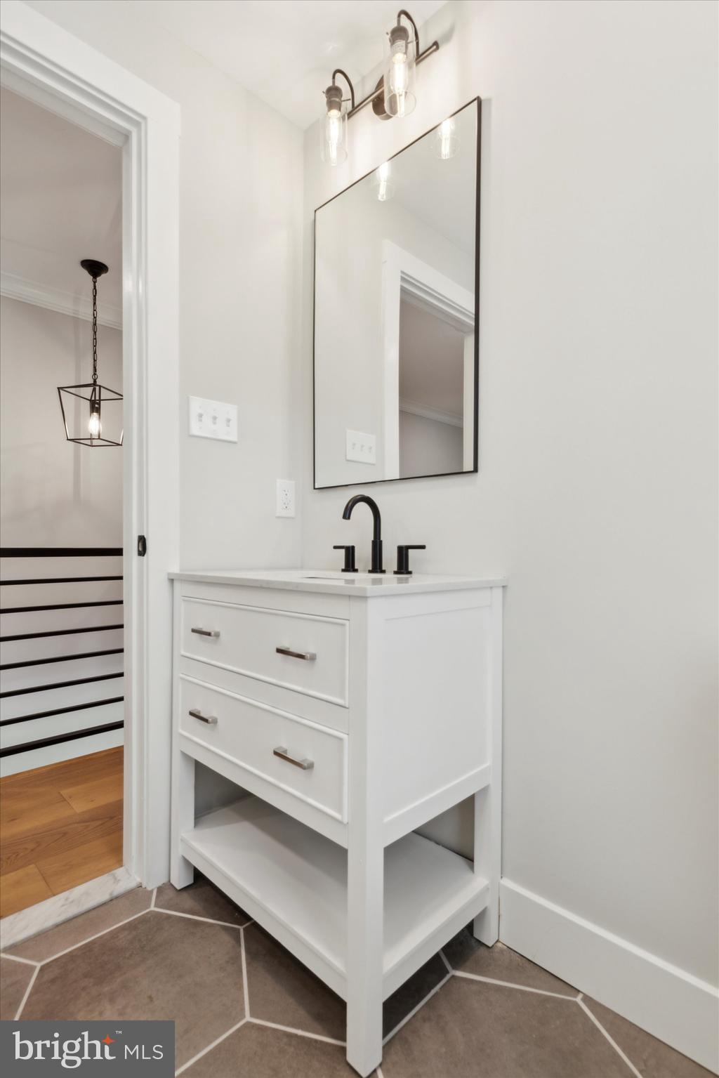 607 Golf Club Road Newtown Square, PA 19073 - Photo 62 of 86 a bathroom with a sink and a mirror