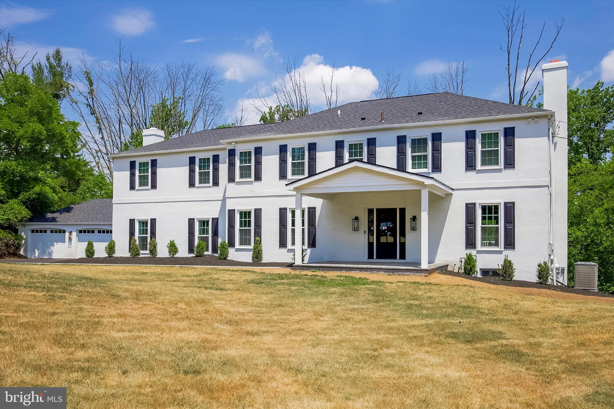 607 Golf Club Road Newtown Square, PA 19073 - Photo 83 of 86 a front view of a house with a garden