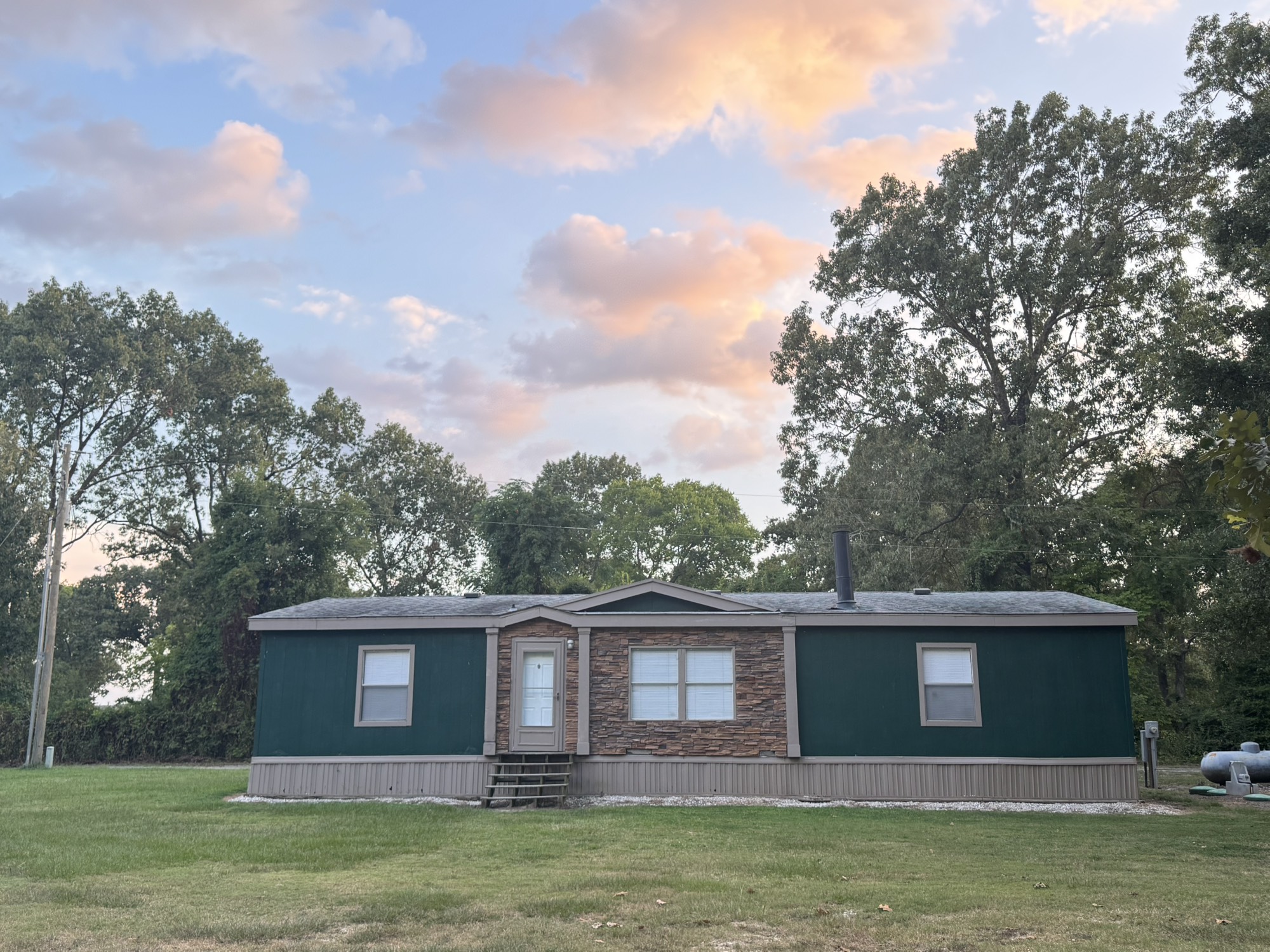 70 Timber Road Point Blank, TX 77364 - Photo 1 of 20 a front view of a house with a garden