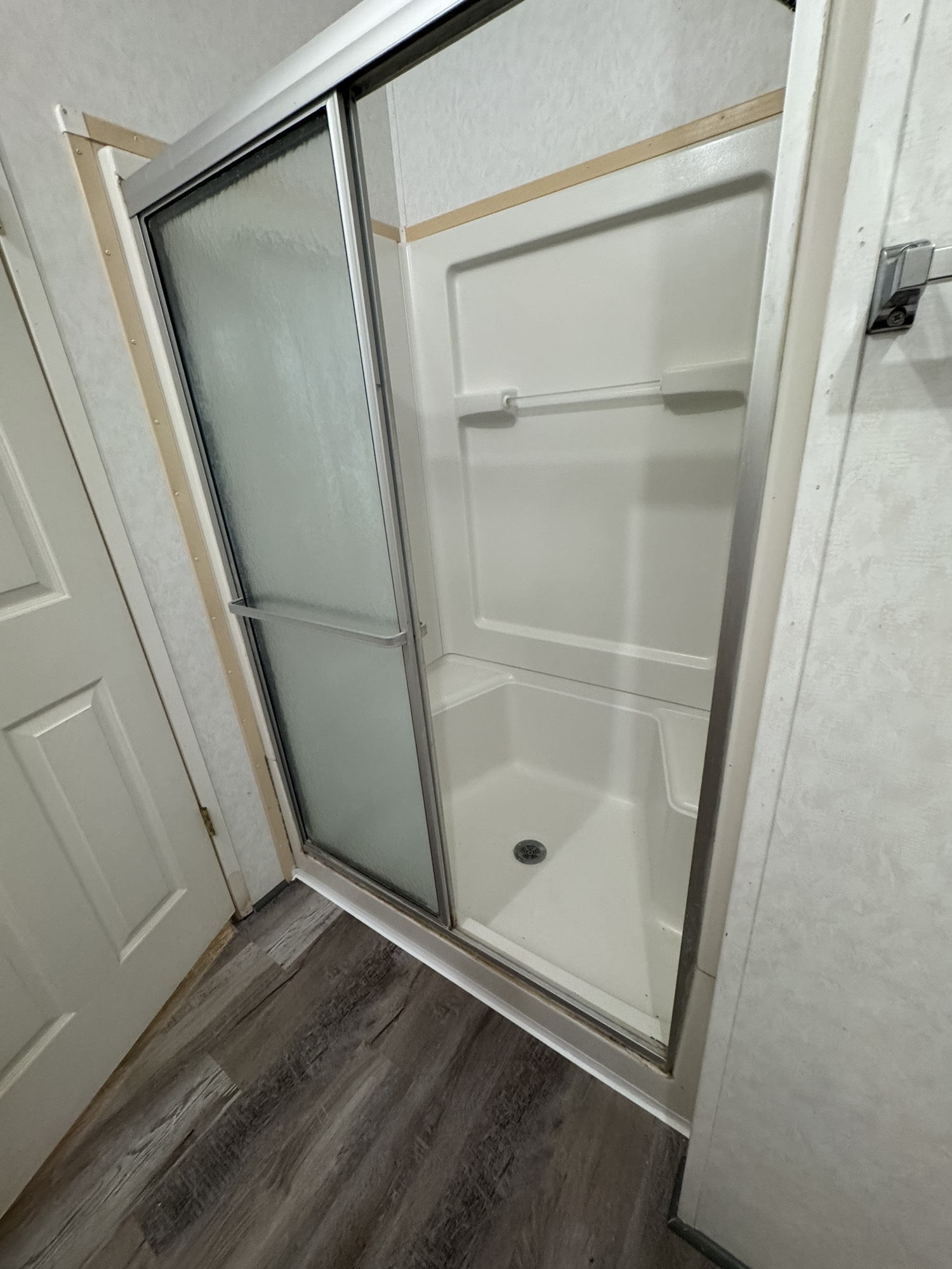 70 Timber Road Point Blank, TX 77364 - Photo 12 of 20 a bathroom with a glass door shower