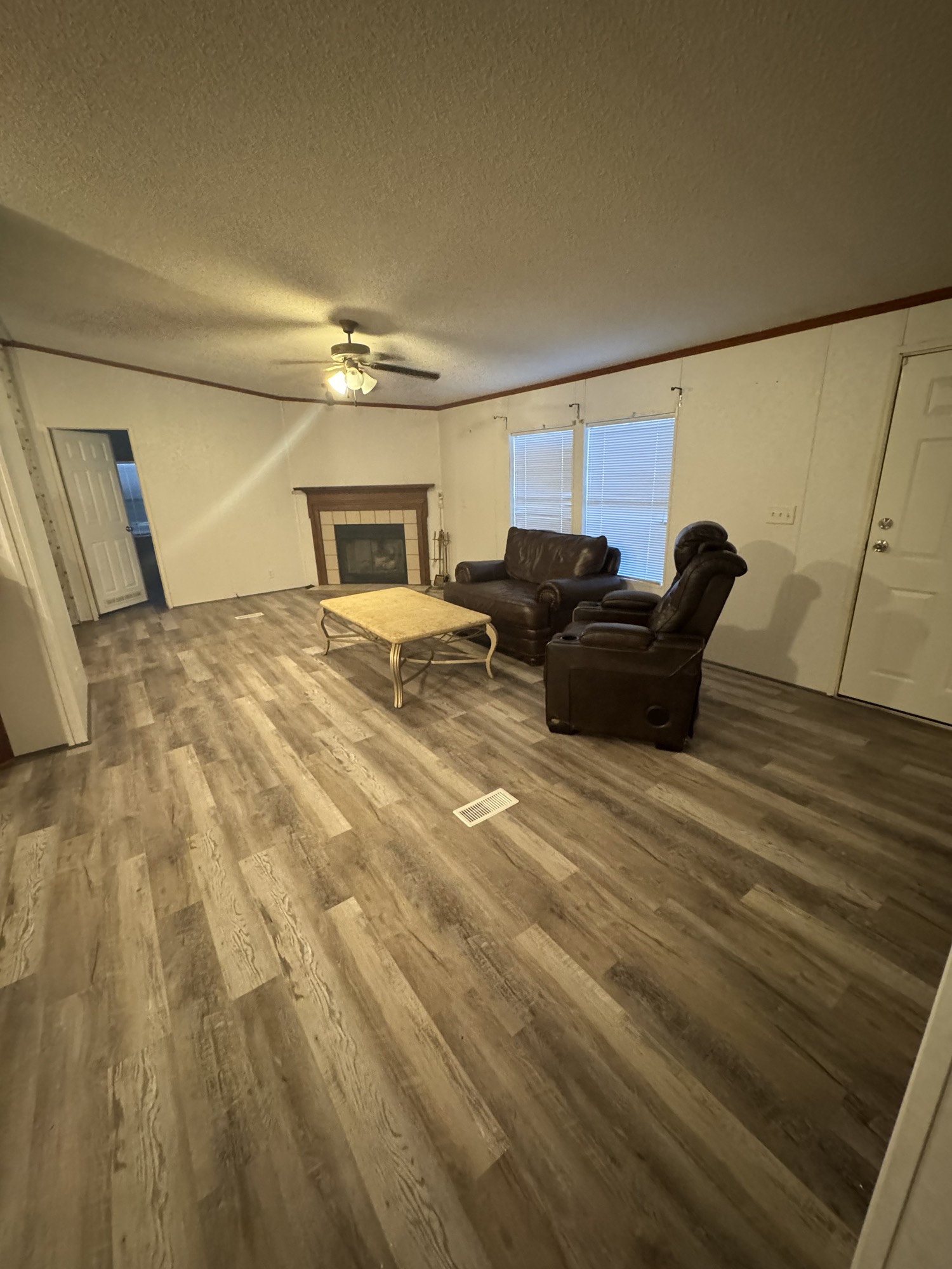 70 Timber Road Point Blank, TX 77364 - Photo 14 of 20 a bedroom with a bed and wooden floor