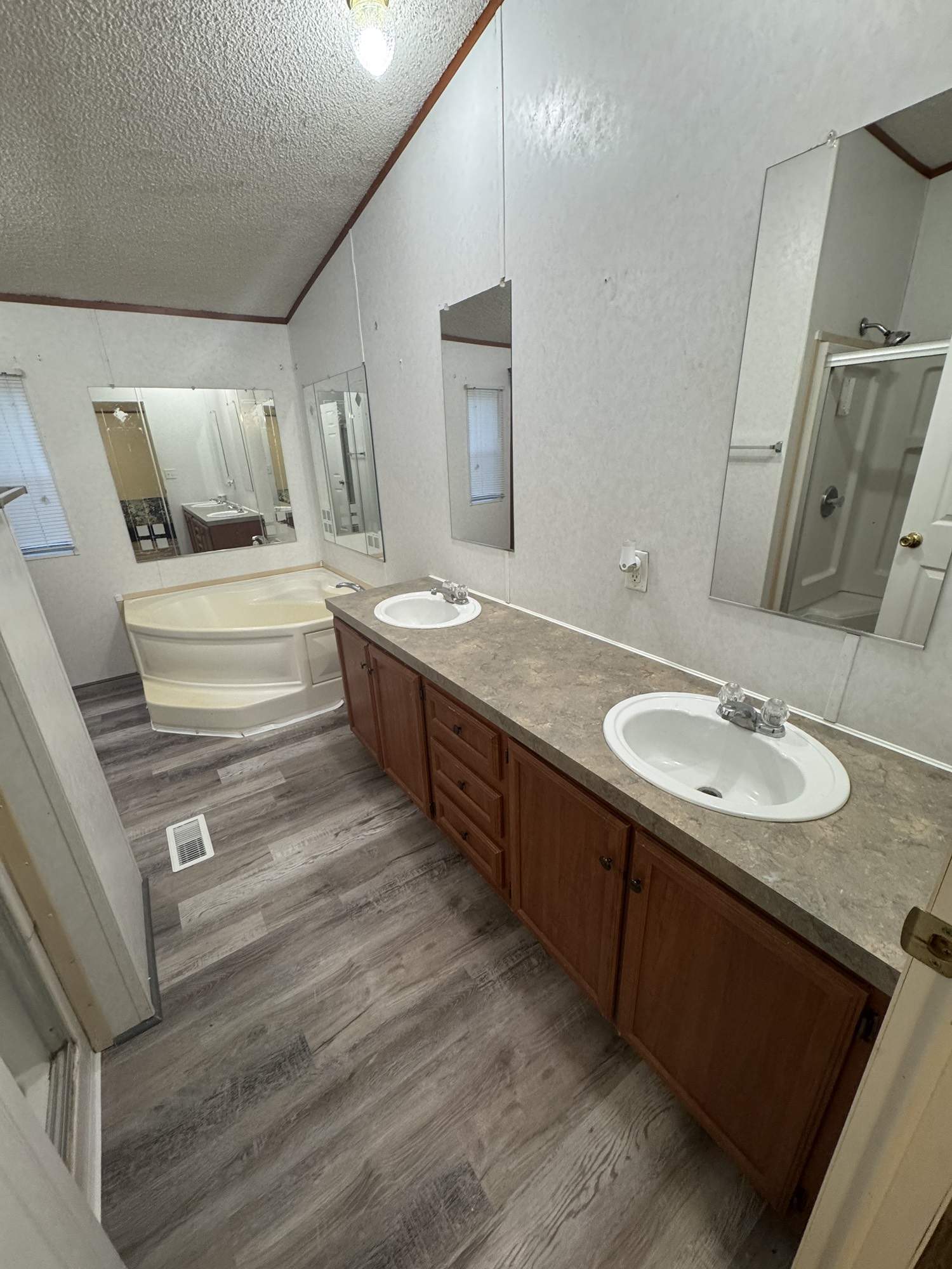 70 Timber Road Point Blank, TX 77364 - Photo 18 of 20 a bathroom with a granite countertop sink and a mirror
