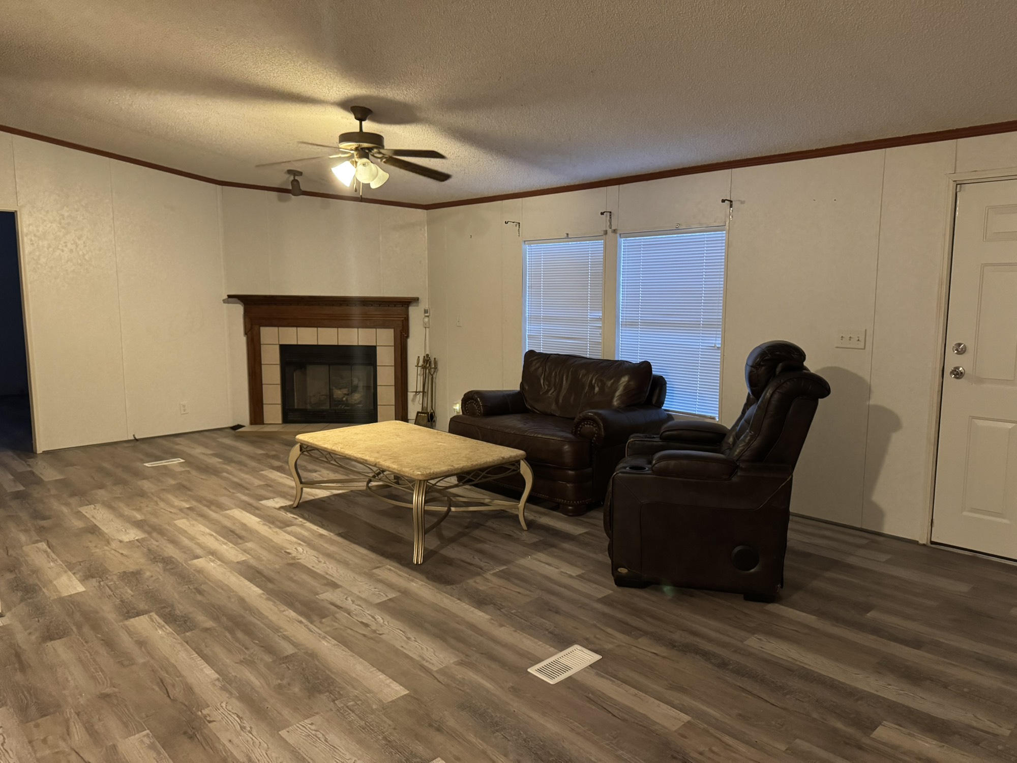70 Timber Road Point Blank, TX 77364 - Photo 2 of 20 a living room with furniture and a fireplace