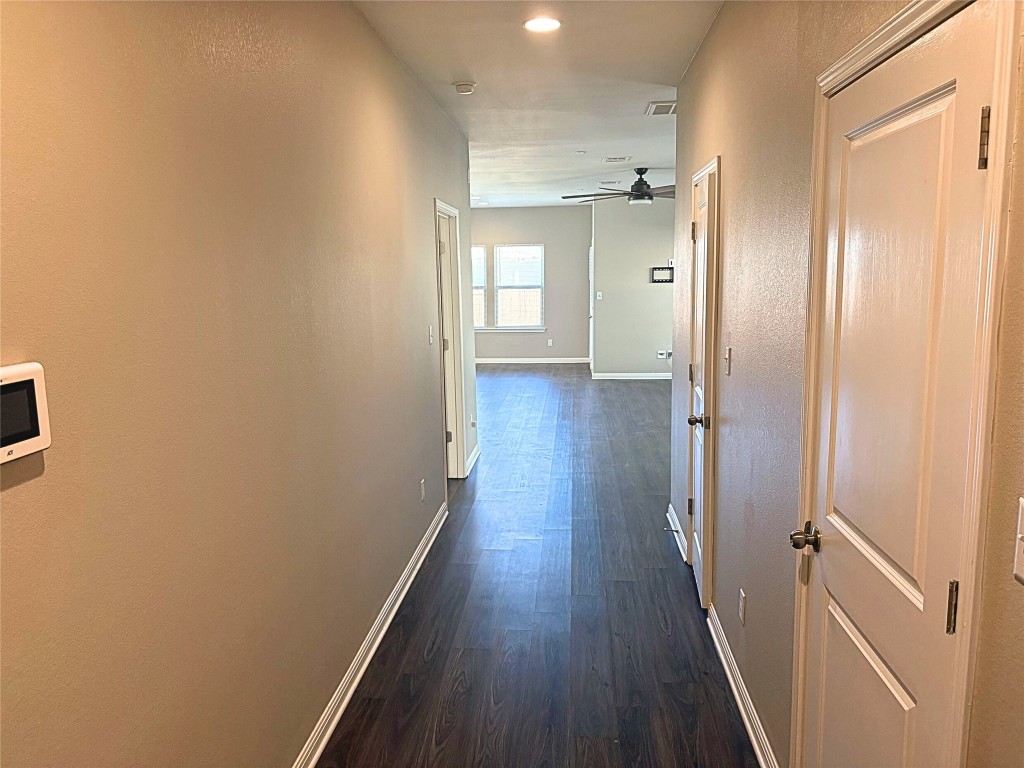 240 Arabian Colt Drive Georgetown, TX 78626 - Photo 3 of 25 a view of a hallway with wooden floor