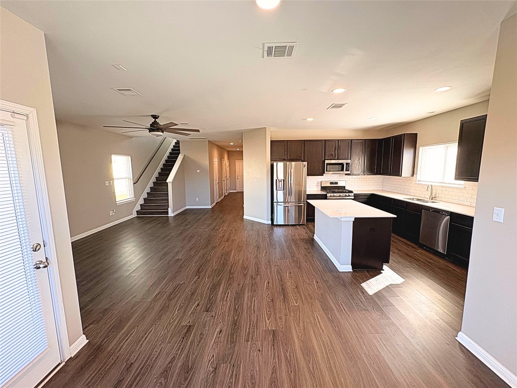 240 Arabian Colt Drive Georgetown, TX 78626 - Photo 25 of 25 a view of kitchen with cabinets wooden floor and stainless steel appliances