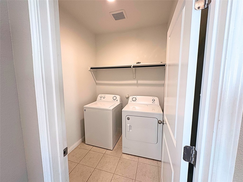 240 Arabian Colt Drive Georgetown, TX 78626 - Photo 7 of 25 a utility room with dryer and washer