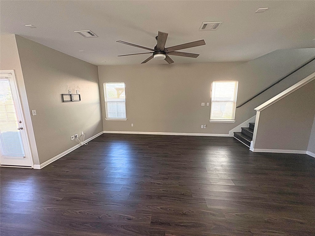 240 Arabian Colt Drive Georgetown, TX 78626 - Photo 9 of 25 an empty room with hard wood floors and windows