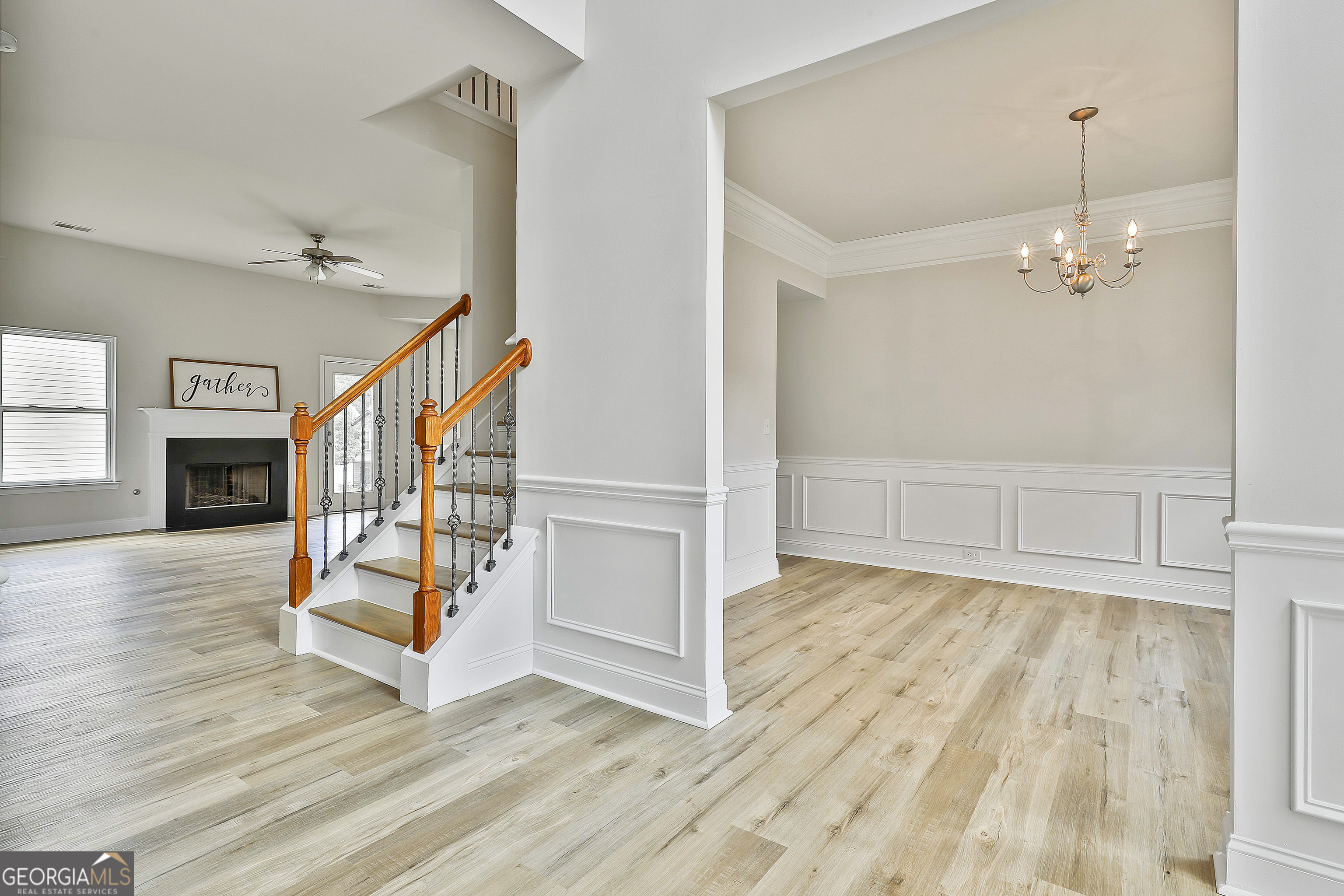 28 Fox Ridge Drive Newnan, GA 30265 - Photo 13 of 48 an empty room with wooden floor fireplace and windows