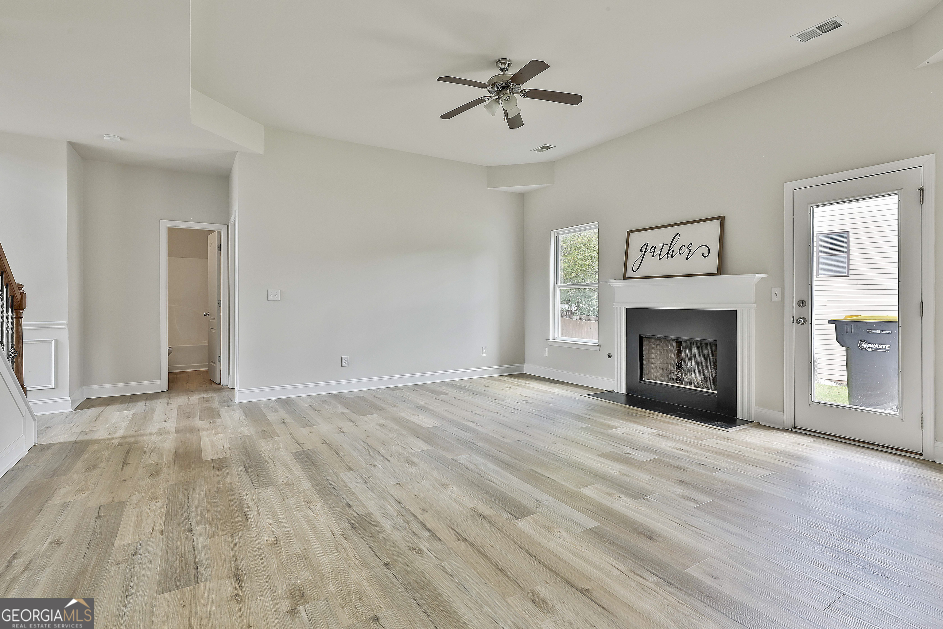 28 Fox Ridge Drive Newnan, GA 30265 - Photo 15 of 48 a view of empty room with wooden floor and fireplace