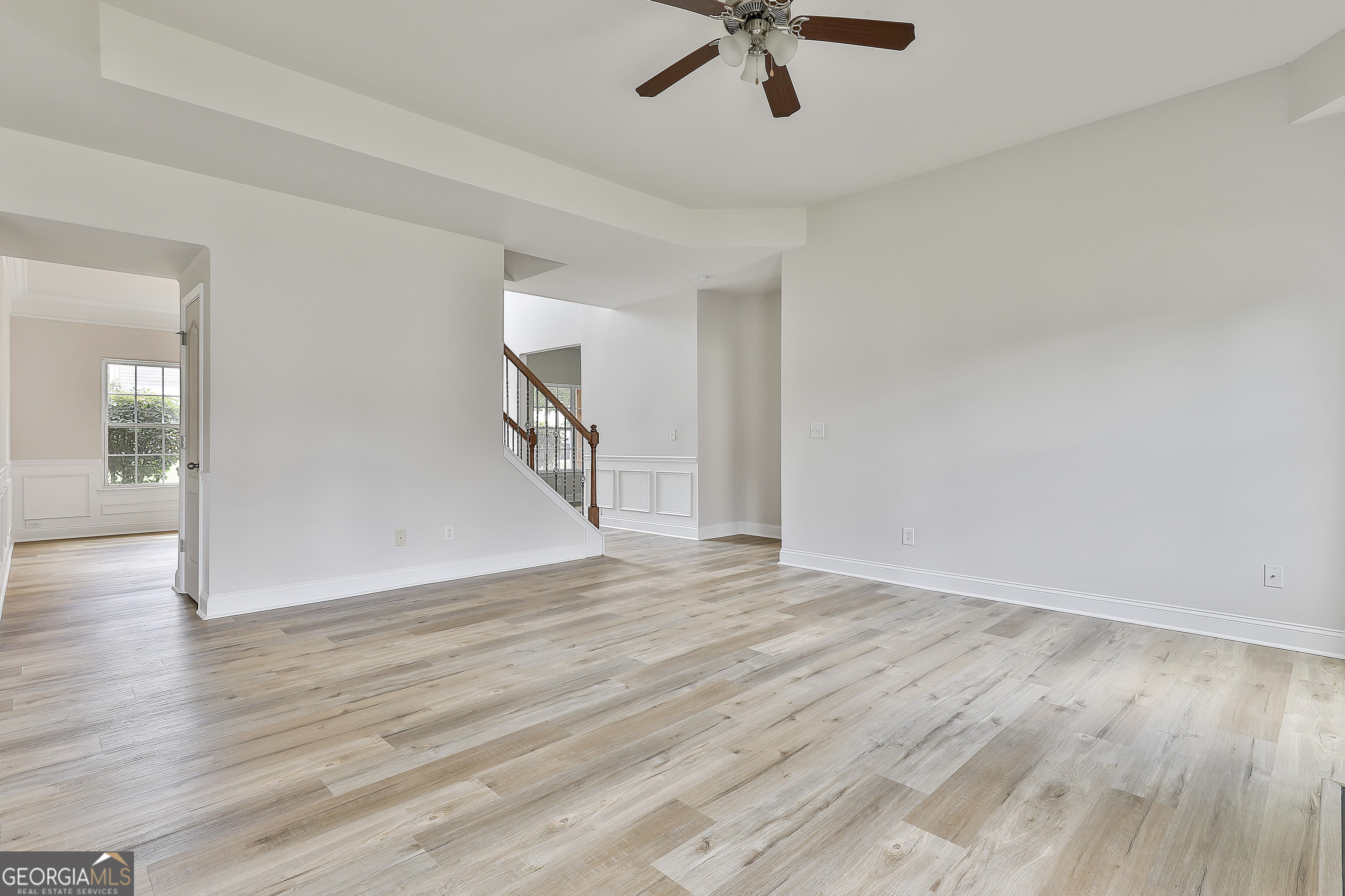 28 Fox Ridge Drive Newnan, GA 30265 - Photo 16 of 48 an empty room with wooden floor and windows