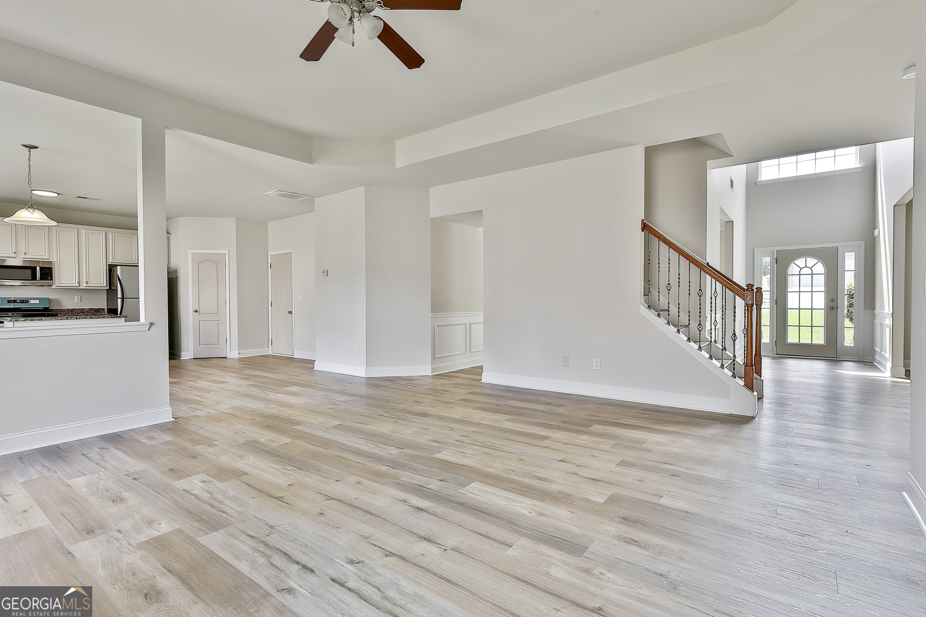 28 Fox Ridge Drive Newnan, GA 30265 - Photo 17 of 48 a view of an empty room and window with wooden floor