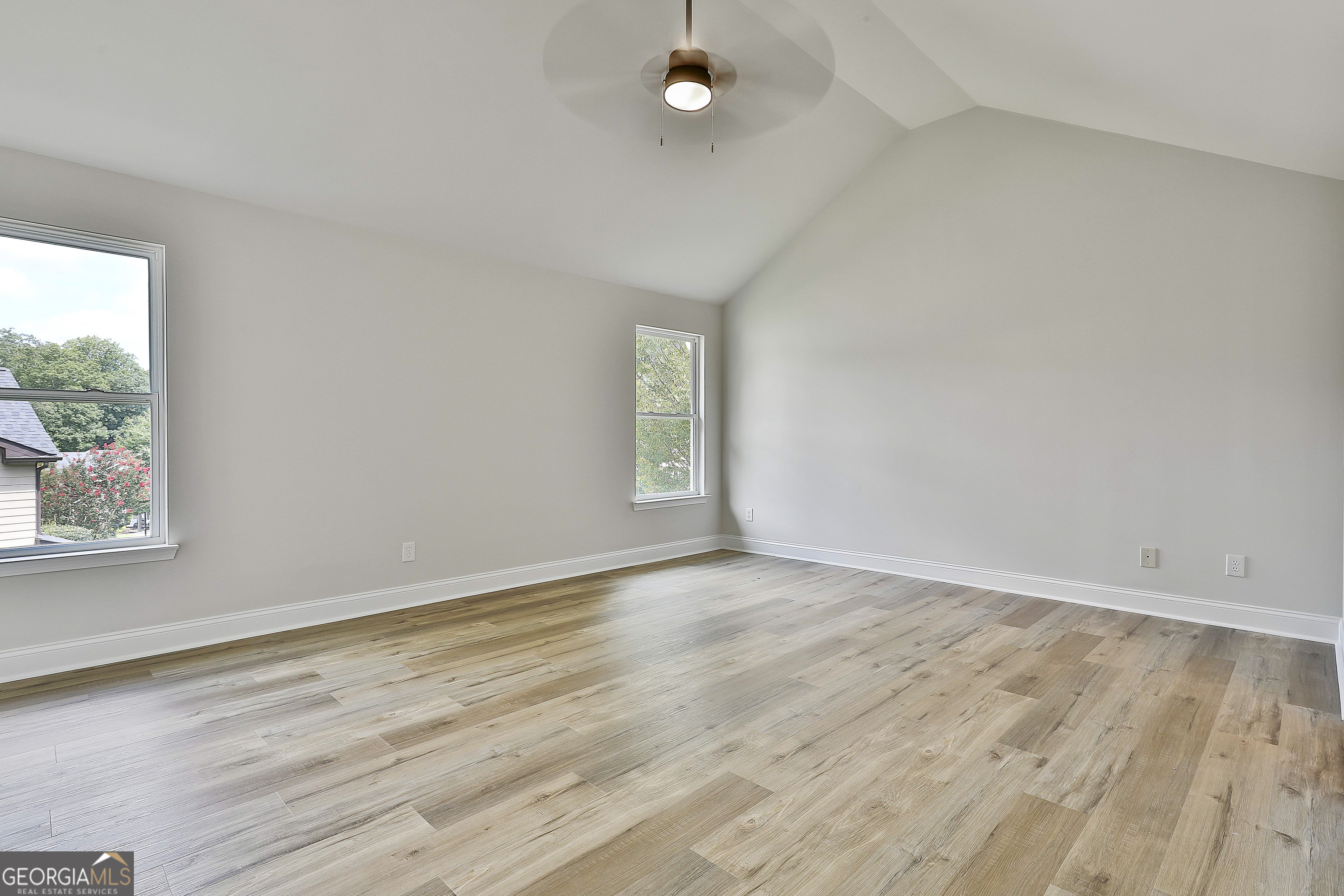 28 Fox Ridge Drive Newnan, GA 30265 - Photo 25 of 48 a view of an empty room with wooden floor and a window