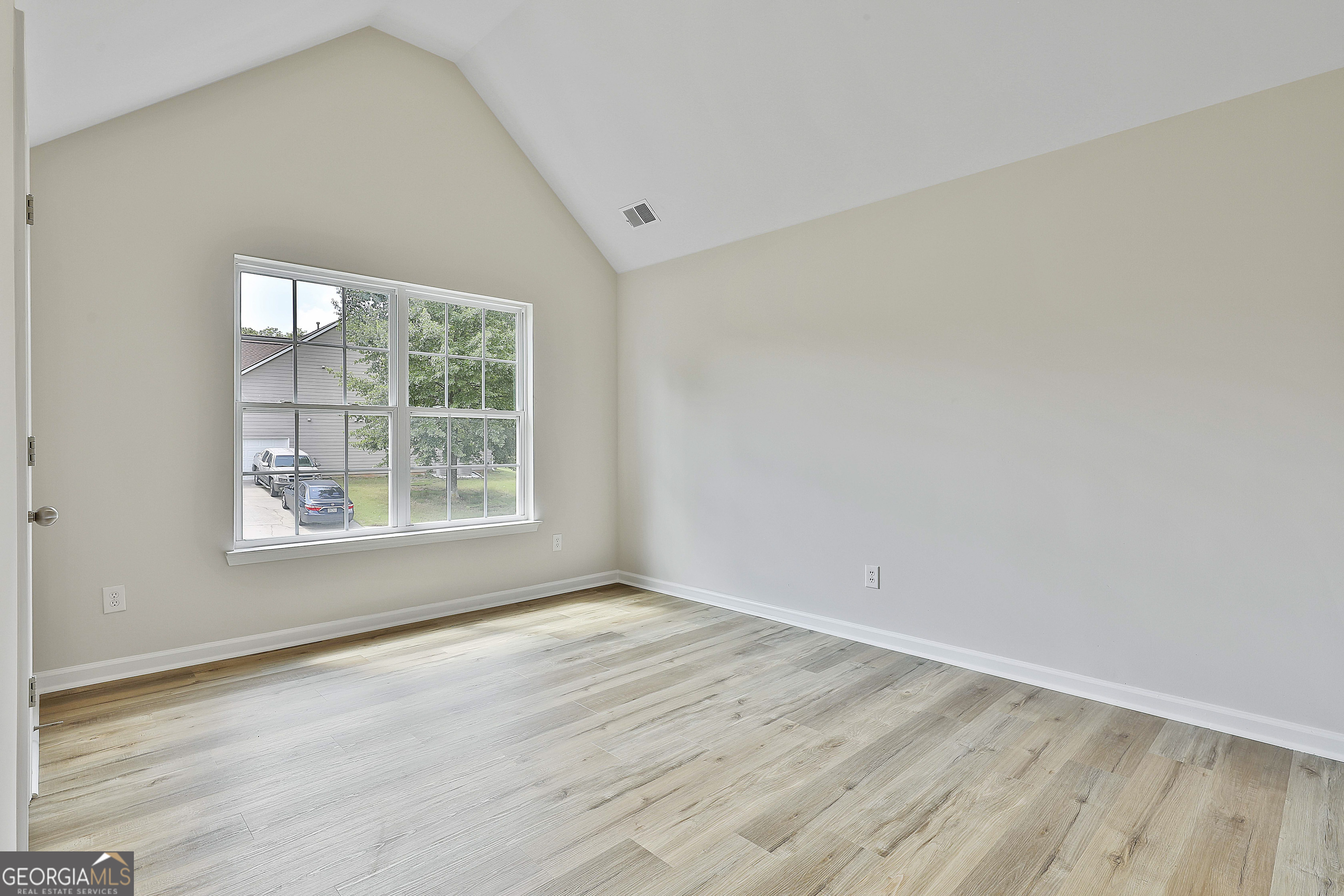 28 Fox Ridge Drive Newnan, GA 30265 - Photo 34 of 48 an empty room with wooden floor and windows