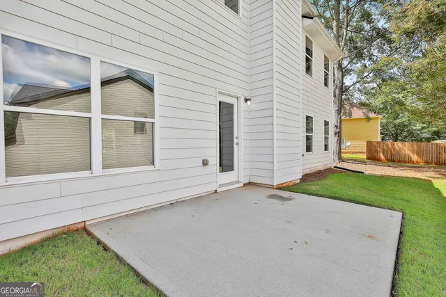 a view of a house with a yard and garage