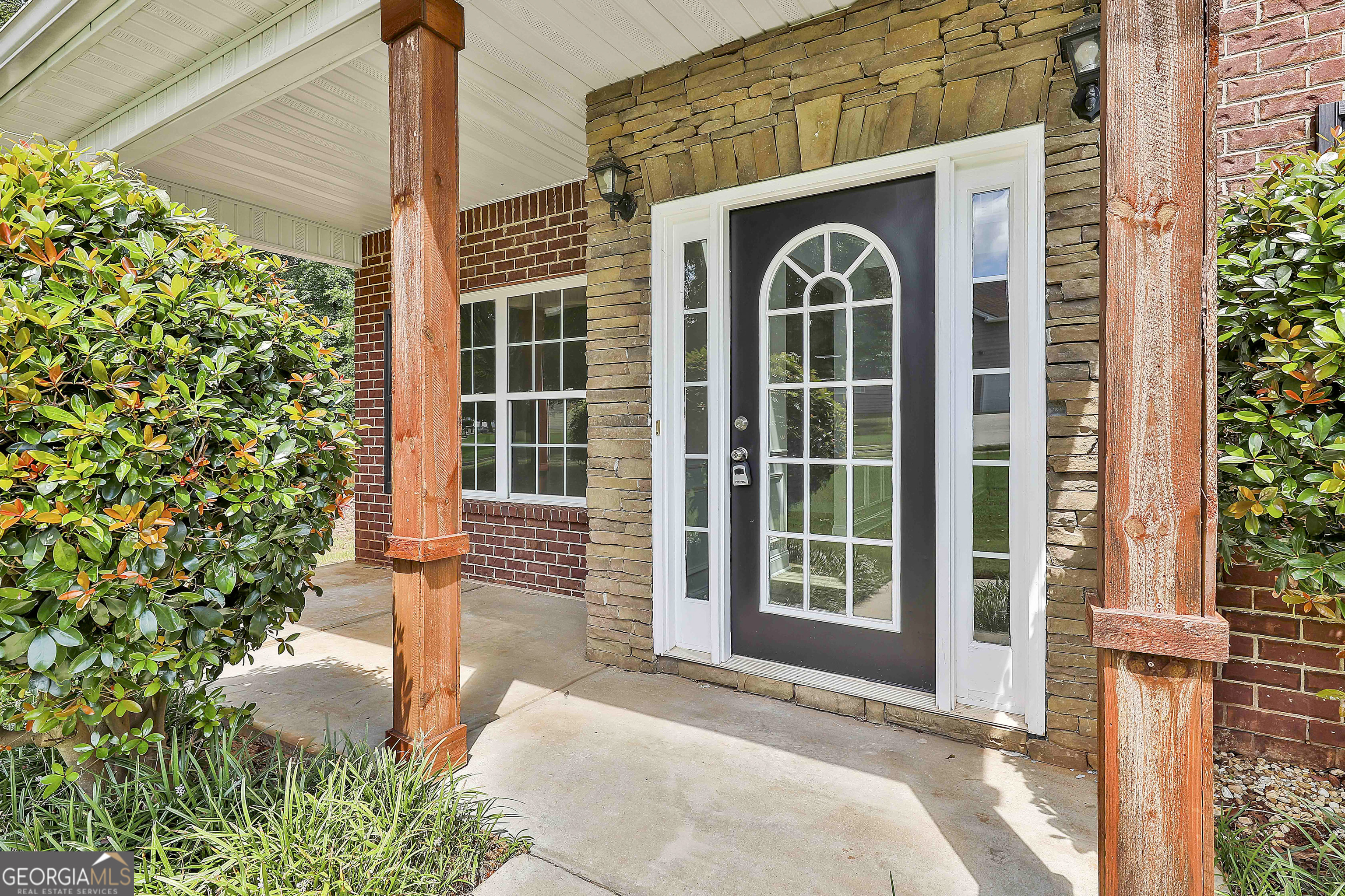 28 Fox Ridge Drive Newnan, GA 30265 - Photo 4 of 48 a front view of a house with outdoor space and garden