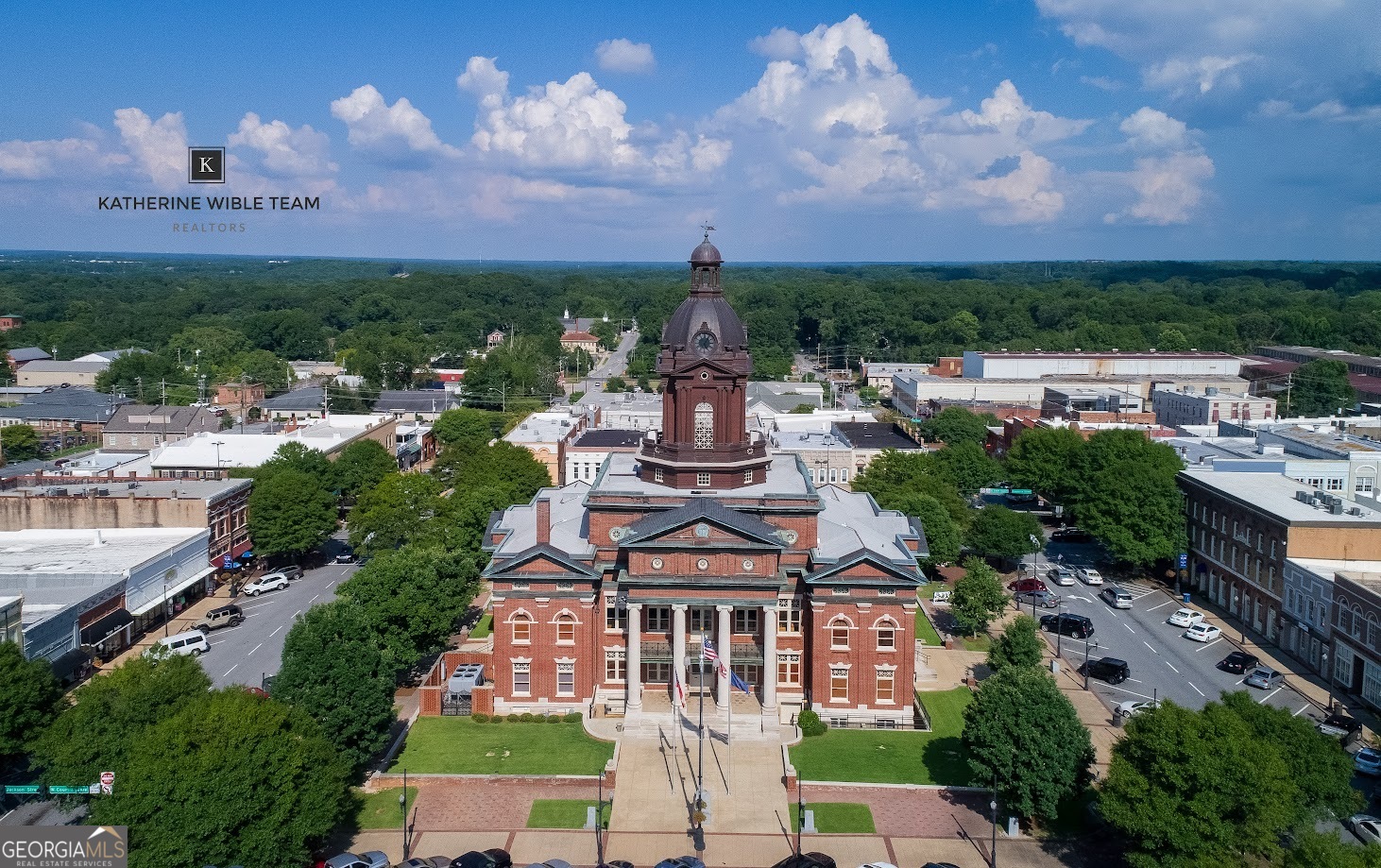 28 Fox Ridge Drive Newnan, GA 30265 - Photo 48 of 48 a view of a lake with a city in the background