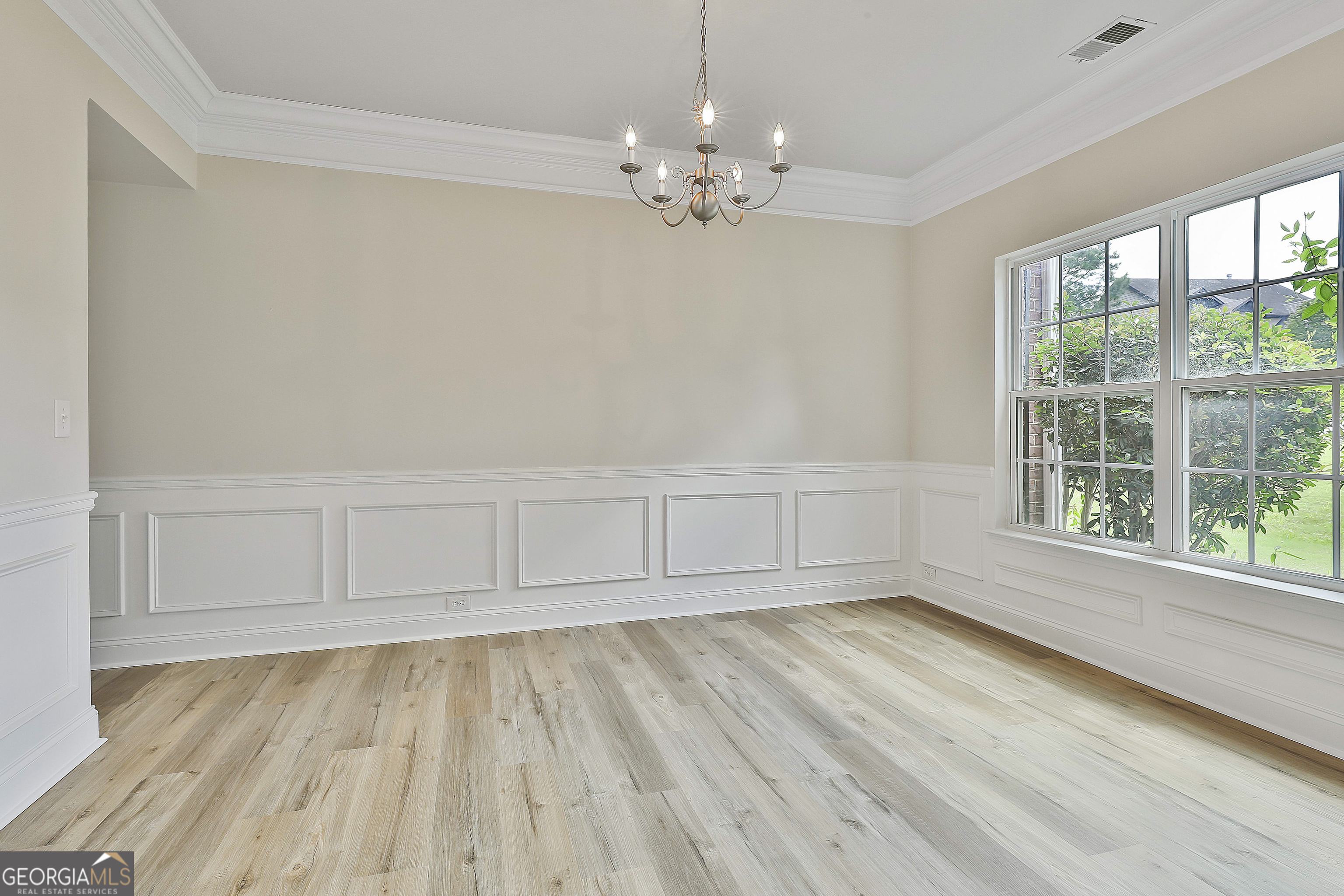 28 Fox Ridge Drive Newnan, GA 30265 - Photo 7 of 48 a view of wooden floor and windows in a room