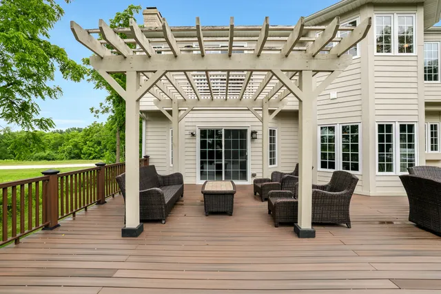 a view of a chair and tables in the balcony