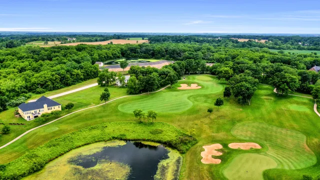 a view of a golf course with a swimming pool