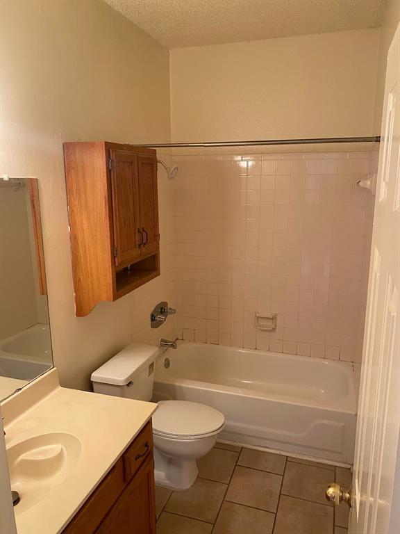 915 West 23rd Street, Unit 108 Austin, TX 78705 - Photo 12 of 14 a bathroom with a sink a toilet and shower
