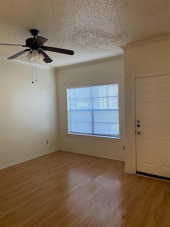 915 West 23rd Street, Unit 108 Austin, TX 78705 - Photo 4 of 14 an empty room with a empty space and windows