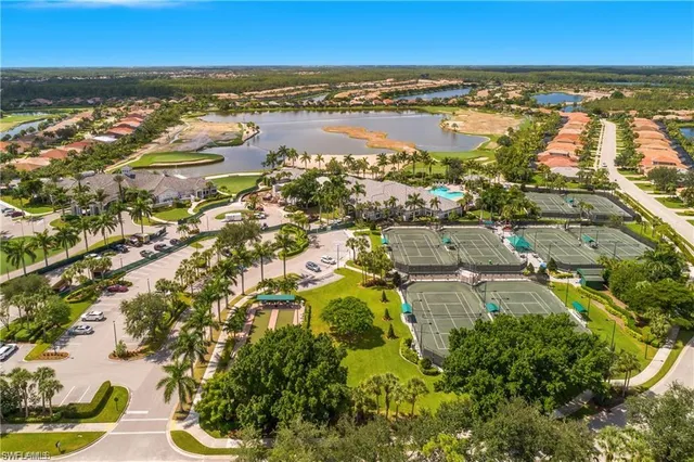 an aerial view of residential building and lake